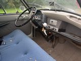 a blue seat in the back of a truck