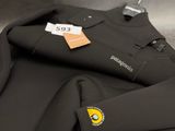 a black wet suit with a yellow logo on it