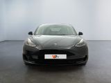 the tesla model s is parked in a white room with a black floor