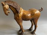statue of a horse on a stone base on a white background