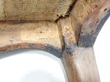 a close up view of a chair with a wood seat