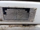 a close up of a metal plate on a white stove