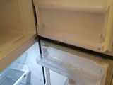 an open refrigerator with the door open and the freezer door open