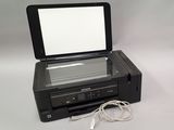 a black printer with a white screen sitting on top of it