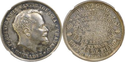 a close up of a coin on a white background with a picture of a man
