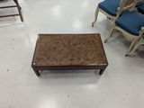 several chairs and a coffee table in a room with a lot of chairs