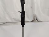 a close up of a black and silver walking stick on a white background