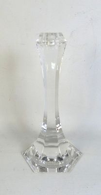 a clear glass candle holder on a white table