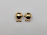 a pair of gold plated earrings on a white background