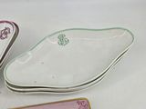 several different types of decorative dishes are sitting on a table