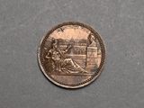 a coin with a picture of a woman and a man on it