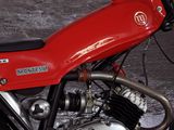 a red motorcycle that is parked on the side of the road