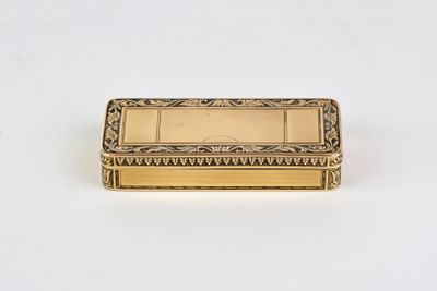 a gold plated box on a white background