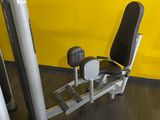 a gym equipment that is in a room with a yellow wall