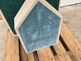 a picture of a wooden box with a blue carpet on it