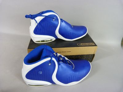 pair of blue and white basketball shoes sitting on top of a box