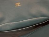 a close up of a purse with a zipper on the inside