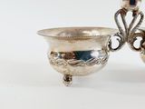 pair of silver plated candlesticks with ornate design