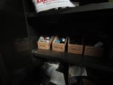 many boxes on the shelves in the room