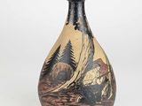 a vase with a painting on it sitting on a table
