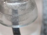 a close up of a metal bell on a metal pole