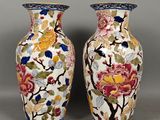 pair of chinese vases decorated with flowers and birds