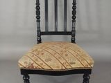 an image of a chair with a patterned seat and back