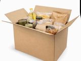 a cardboard box filled with food and condiments