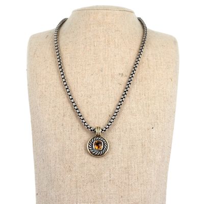 a close up of a necklace on a mannequin mannequin