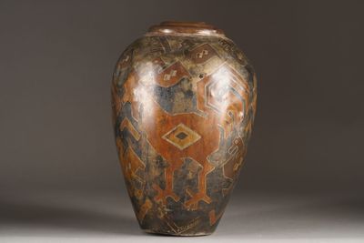 a vase that has a design on the inside of it