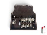 a leather case with a set of silverware in it