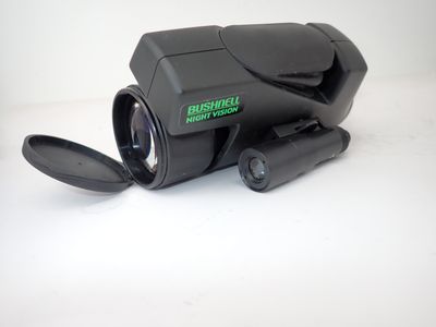 a black camera that is sitting on a white surface