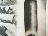 a black and white photo of a magazine with a picture of a bullet