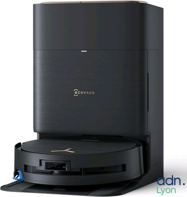 a close up of a black coffee machine on a white surface
