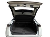 the back of a white car with its trunk open on a white background