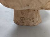 a close up of a piece of wood with a number on it