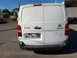 a white van that is parked in a parking lot
