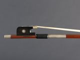 a close up of a violin bow with a wooden handle