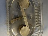 a close up of a plastic container with a pair of scissors in it