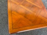 a table that has a wooden top on it