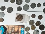 a lot of coins on the table with a card