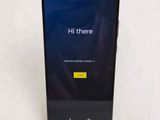 the back of a black phone with the text hit there on the screen