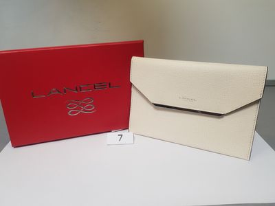 a red and white box with a white purse on top of it