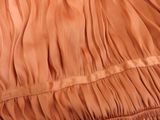 an image of a close up of a dress with pleas