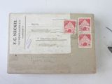 an old envelope with a stamp and a pair of scissors on it