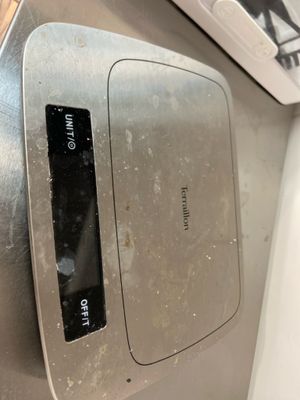 a toaster that is on the counter in the kitchen