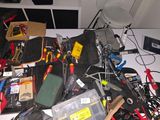 a pile of electronics that is on a table