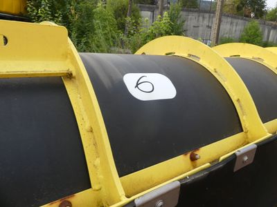 a large black and yellow pipe with a number 6 on it