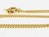 an image of a gold chain bracelet with a diamond on it