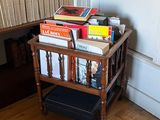 a small table with books on top of it in a room